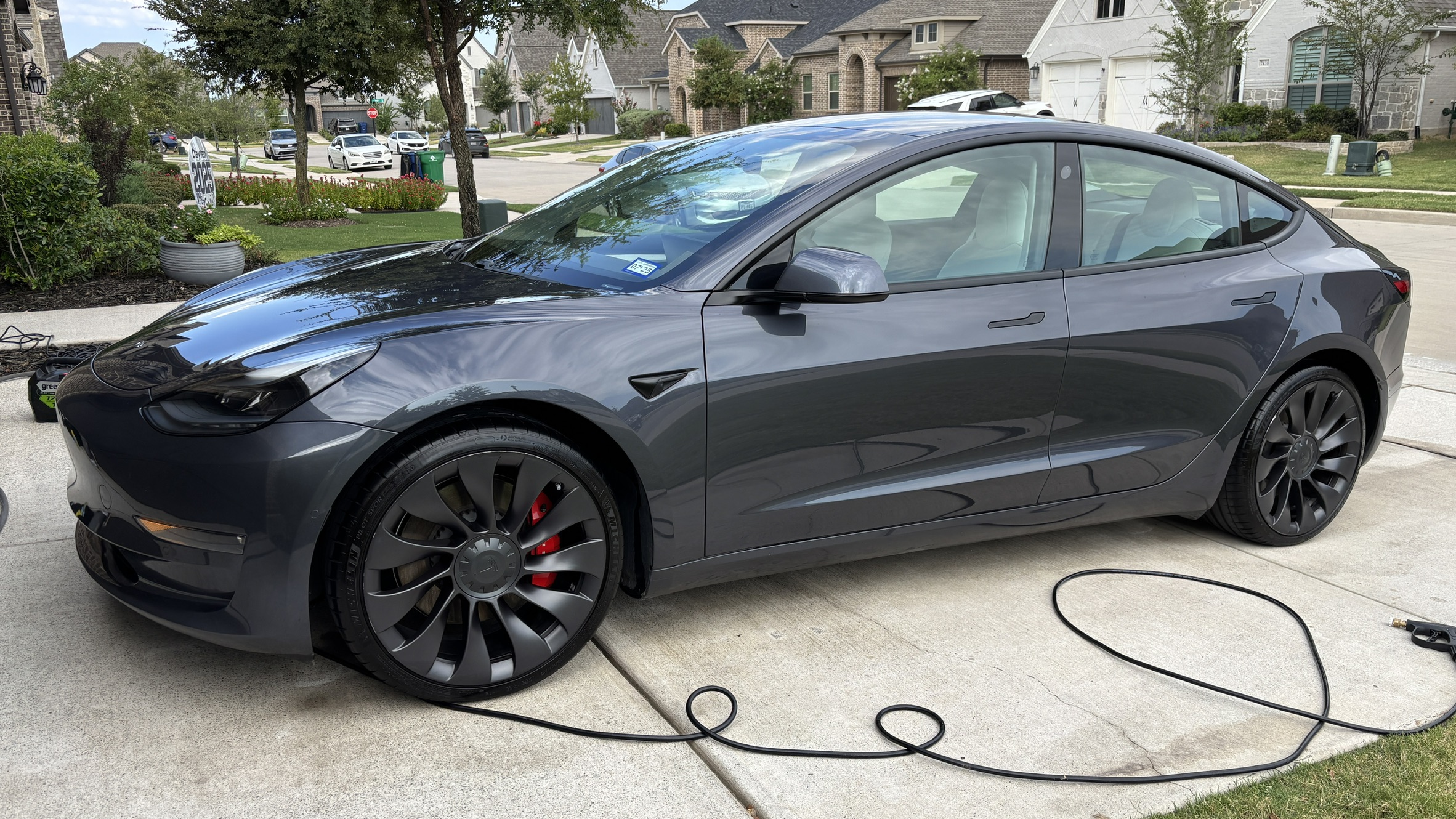 Detailed luxury car paint showing wet-look reflection